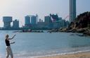 Out on the less busy south side of Hong Kong island, flying kites on the beach with a powerplant in the background.